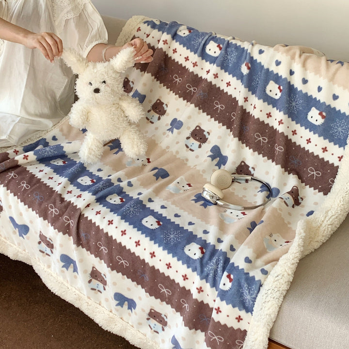 Reversible fleece blanket with cartoon cat design and teddy lining