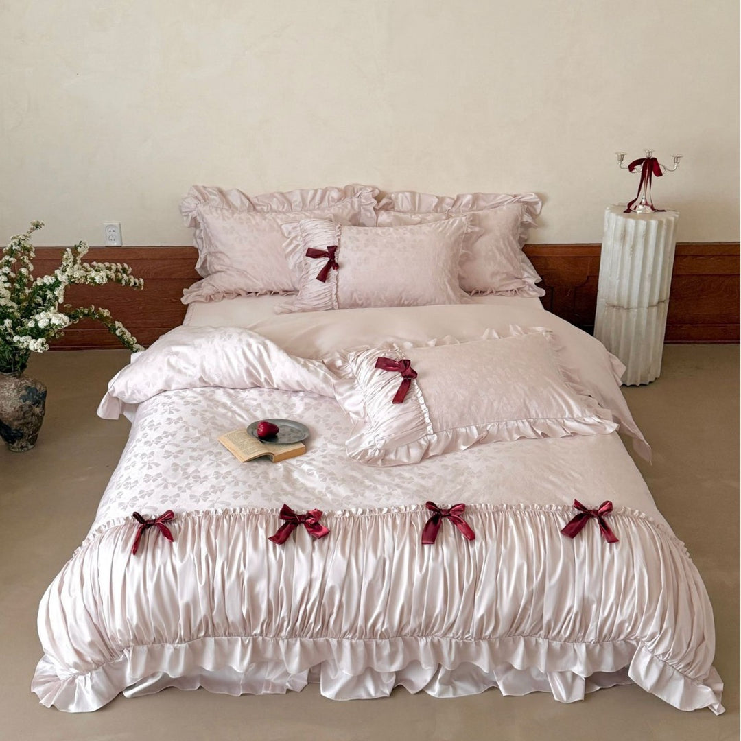 Luxurious satin bedding set with ruffles and decorative bows