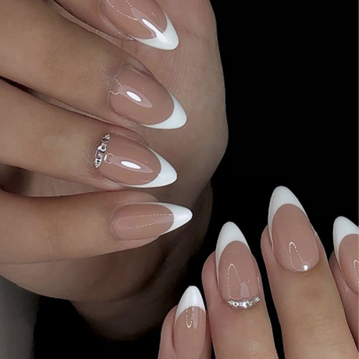 Artificial nail set with elegant French tip look and shimmering accents Stornfield