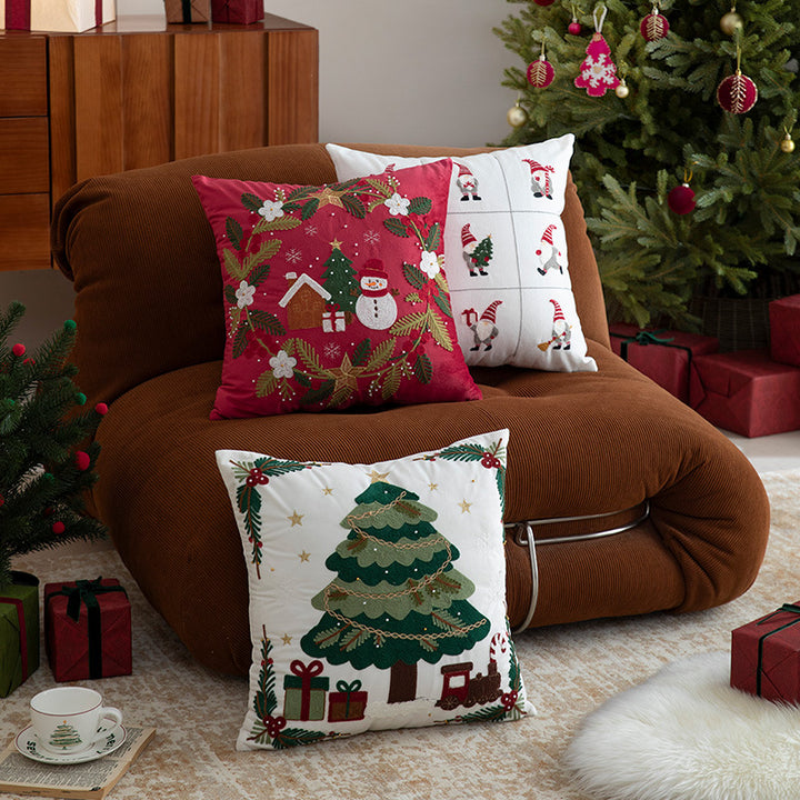 Festive embroidered decorative pillow with reindeer motif and removable cover