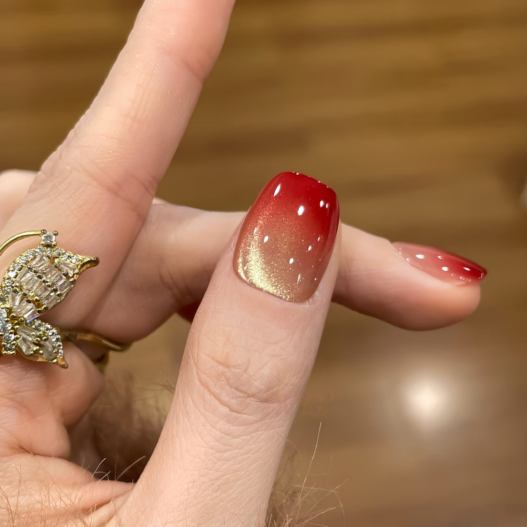Artificial nails with festive gradient color and elegant decorations Stornfield