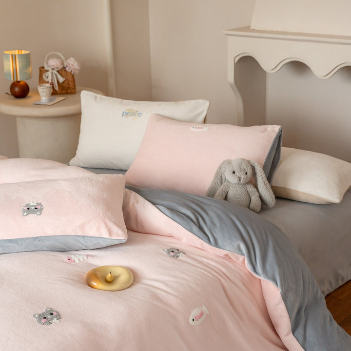 Bedding set with embroidered motif details, pompom trim and soft woven cotton finish