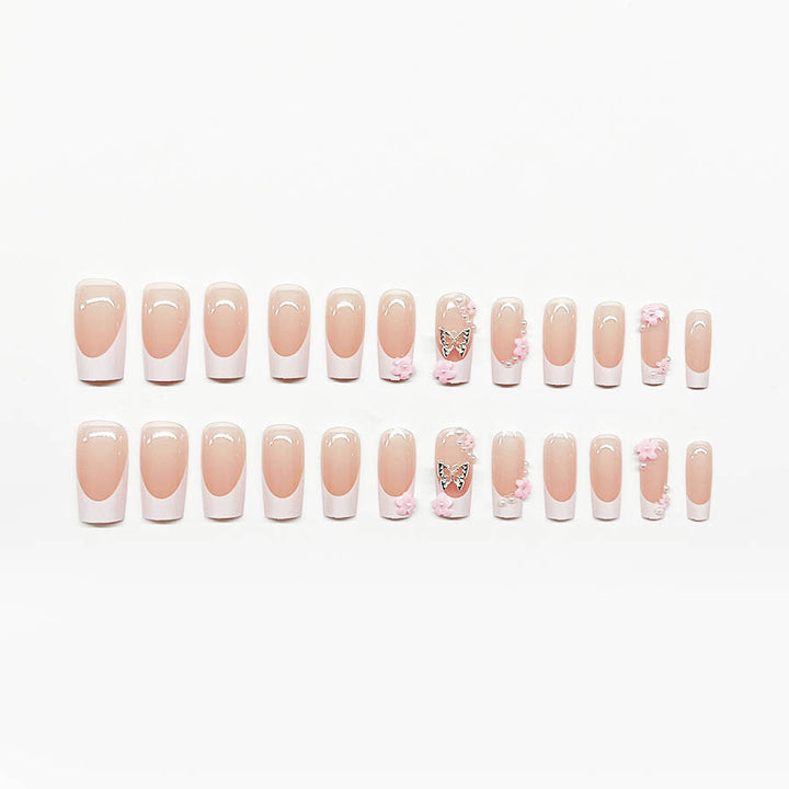 Artificial nail set with playful 3D flowers and glitter accents Stornfield
