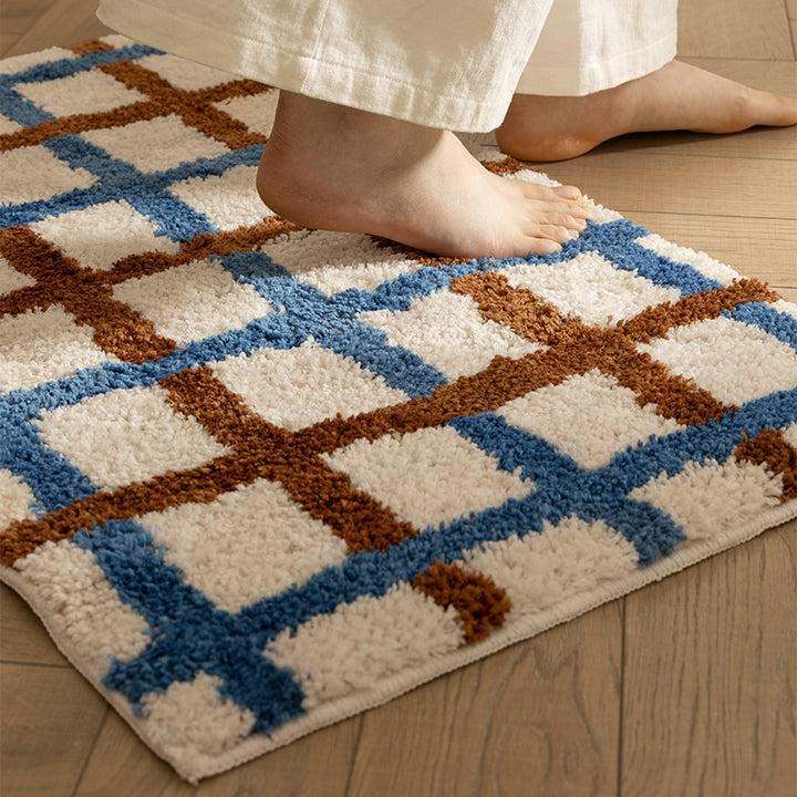 Short pile bath mat with geometric check pattern and non-slip backing Stornfield