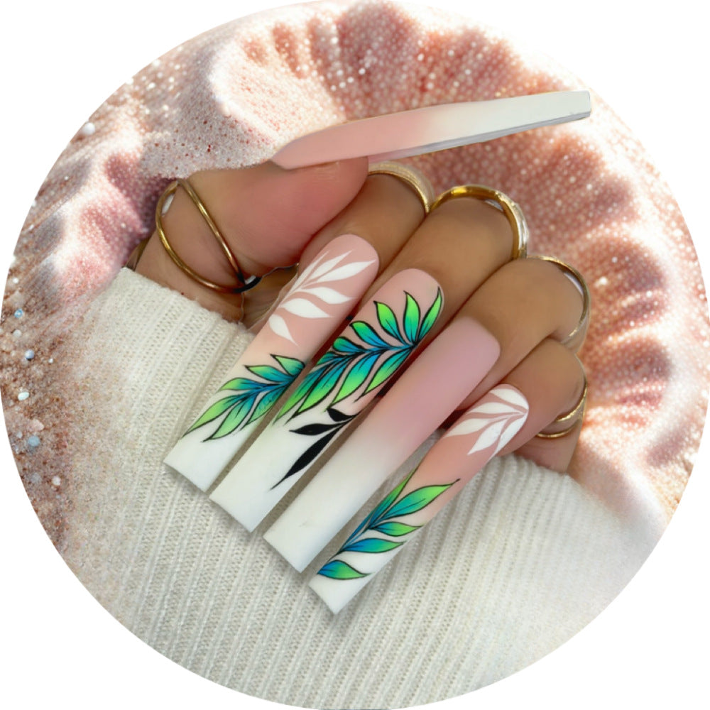 Artificial nails with elegant ombre design and floral accents Stornfield