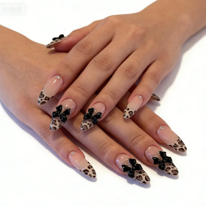Creative artificial nails with stylish leopard pattern and bow accents Stornfield