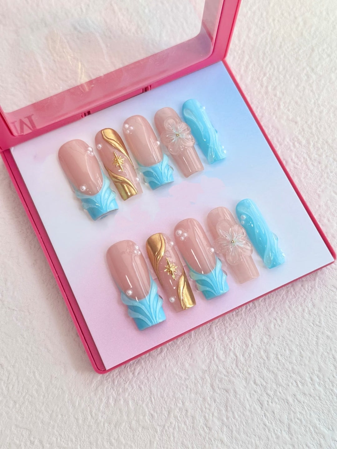 Artistic Press-On Nail Set with Floral and Gold Accents