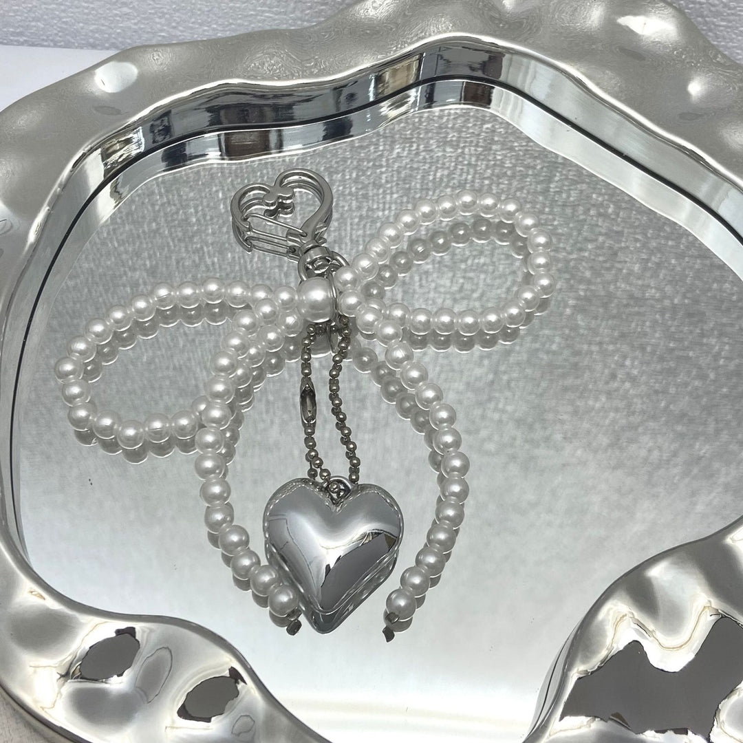 Elegant Pearl Bow Keychain Stornfield