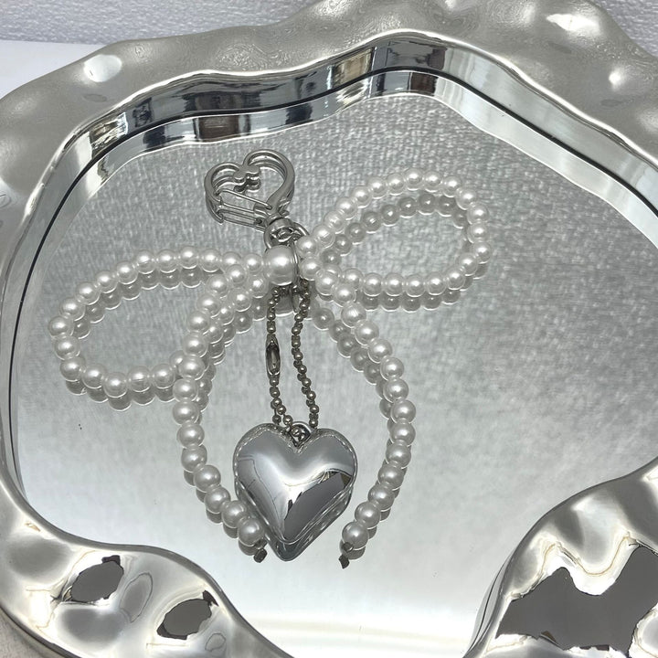 Elegant Pearl Bow Keychain Stornfield