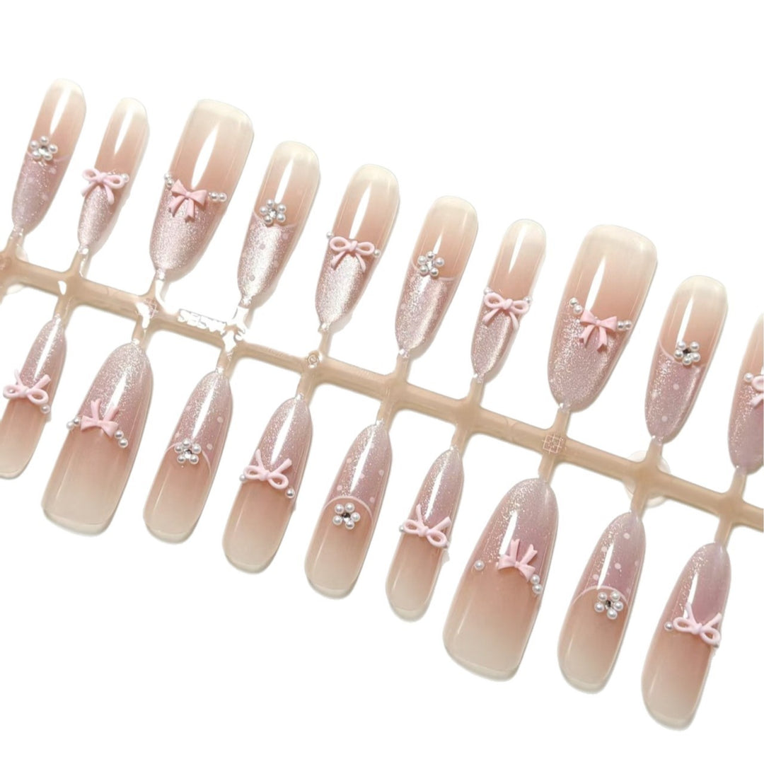 Artificial nails with elegant glitter and bow design Stornfield