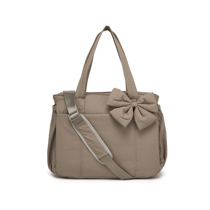 Fashionable tote bag with elegant bow appliqué Stornfield