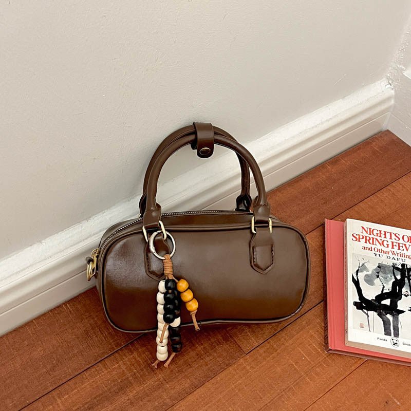 Vintage-Inspired Glossy Handheld Satchel