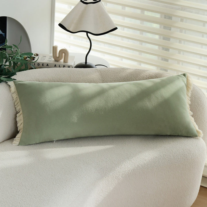 Long decorative cushion with fringe edge