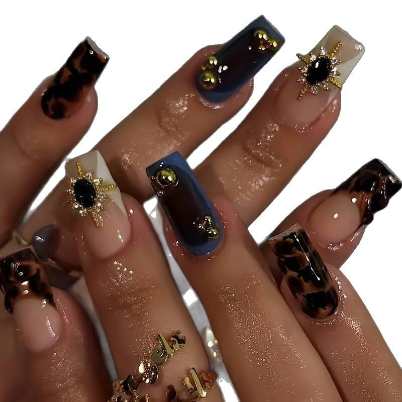 Artistic Patterned Press-On Nail Set with Decorative Elements Stornfield