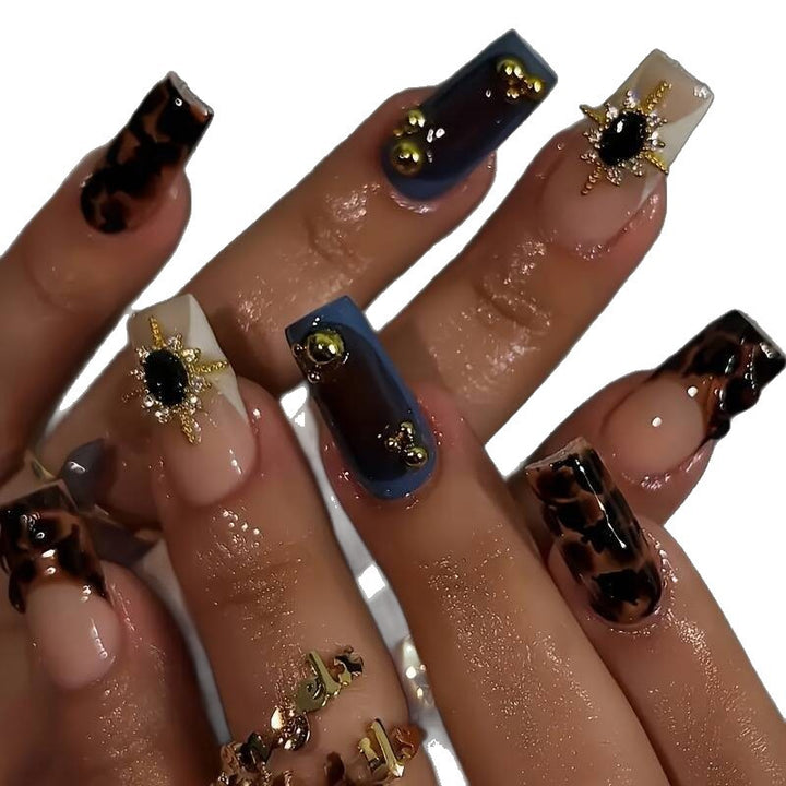 Artistic Patterned Press-On Nail Set with Decorative Elements Stornfield