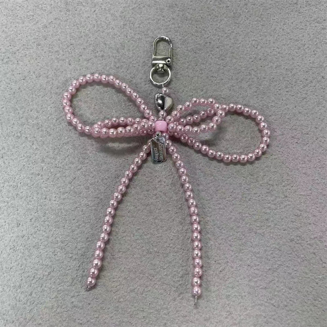 Elegant Pearl Bow Keychain Stornfield