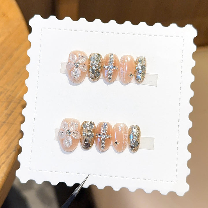 Glamorous artificial nails with floral and glittering accents Stornfield