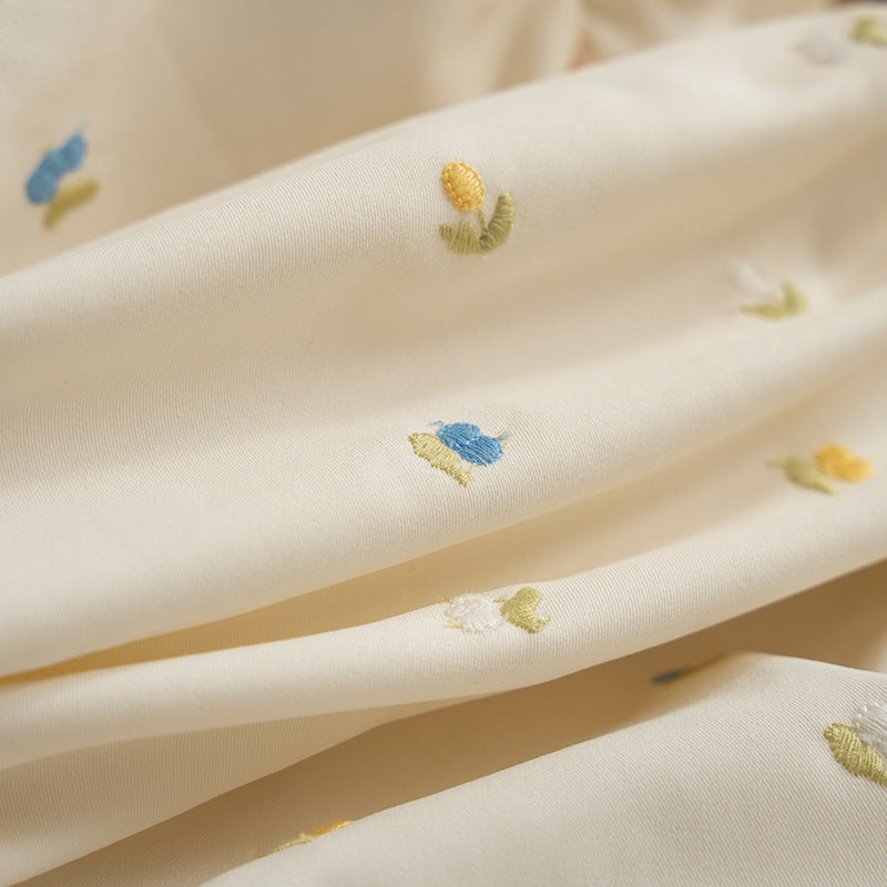 Square embroidered cushion cover made of cotton blend with frill edge Stornfield