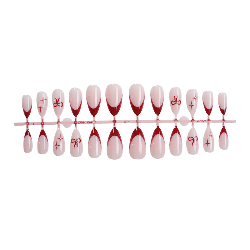 Creative artificial nail set with elegant bow and gradient design Stornfield