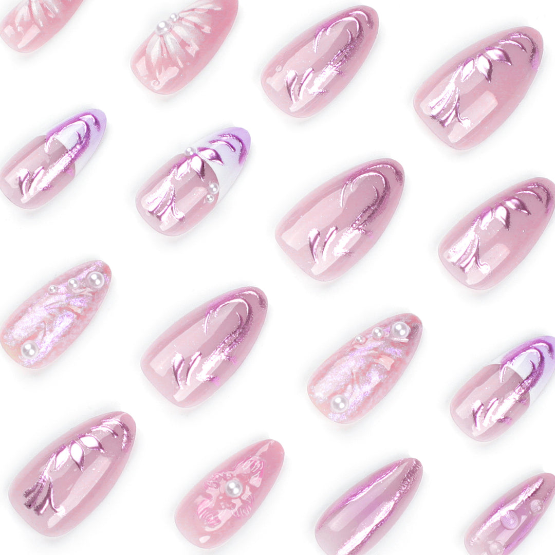 Artificial nail extensions with delicate floral designs and glitter accents Stornfield
