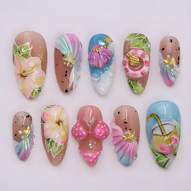 Artificial nail set with botanical designs and glamorous accents Stornfield