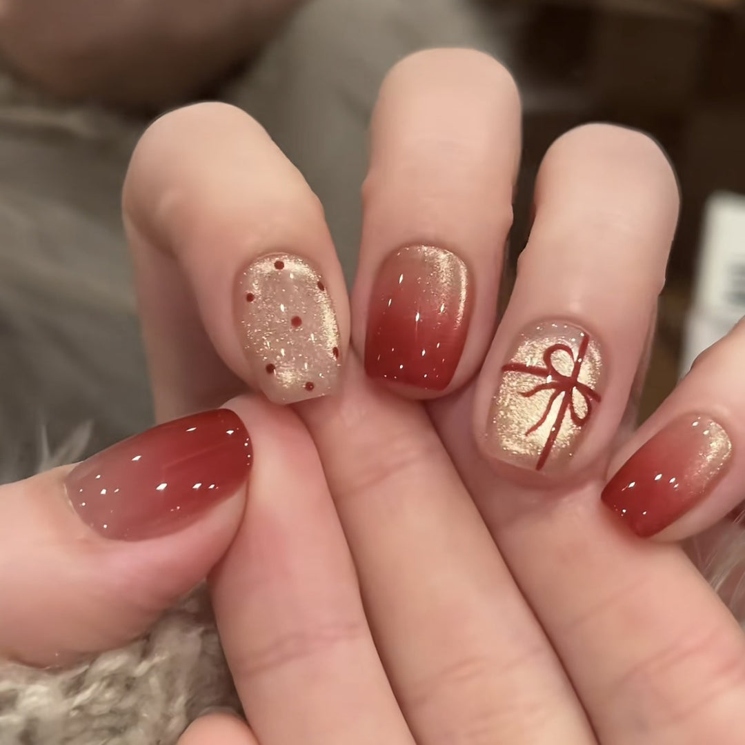 Artificial nails with festive gradient color and elegant decorations Stornfield