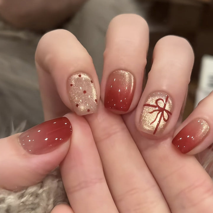 Artificial nails with festive gradient color and elegant decorations Stornfield