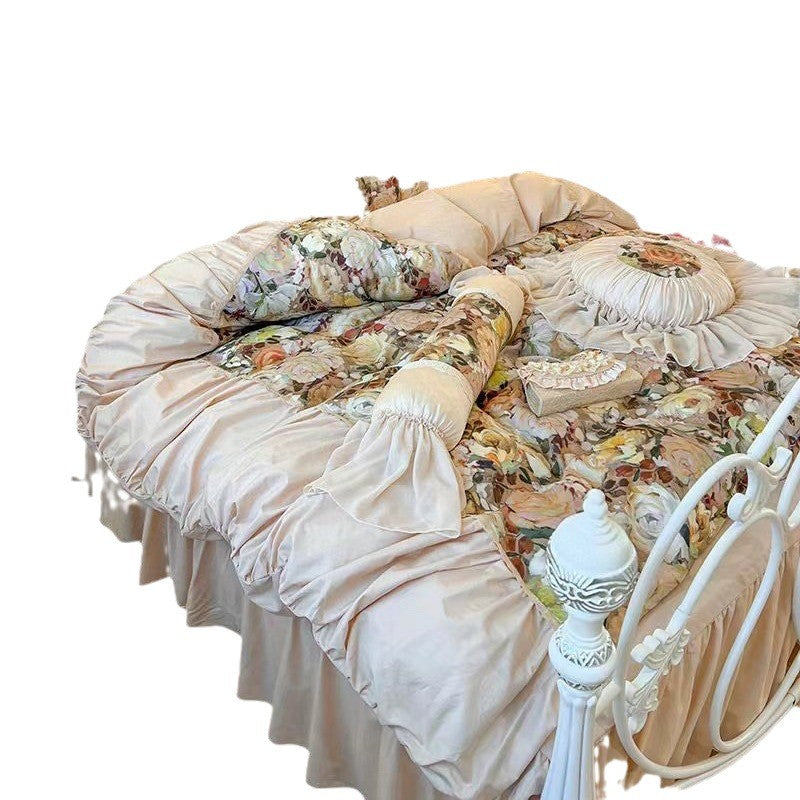 Romantic bedding set with ruffles, quilted bedspread and decorative cushion