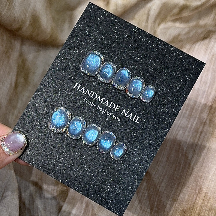 Handmade art nails with shimmering effects Stornfield