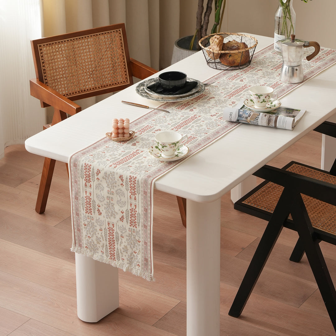 Jacquard table runner with floral border pattern and fringes