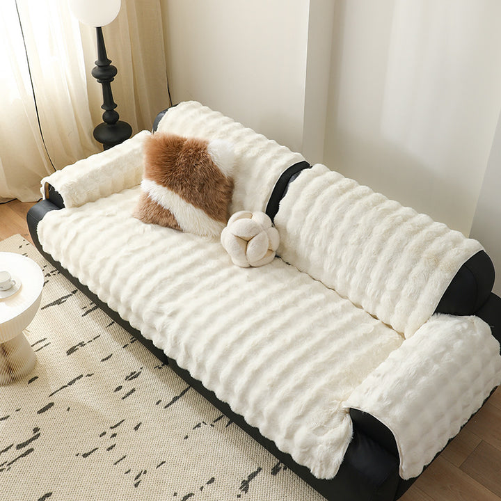 Luxurious sofa cover made of faux fur with ribbed texture