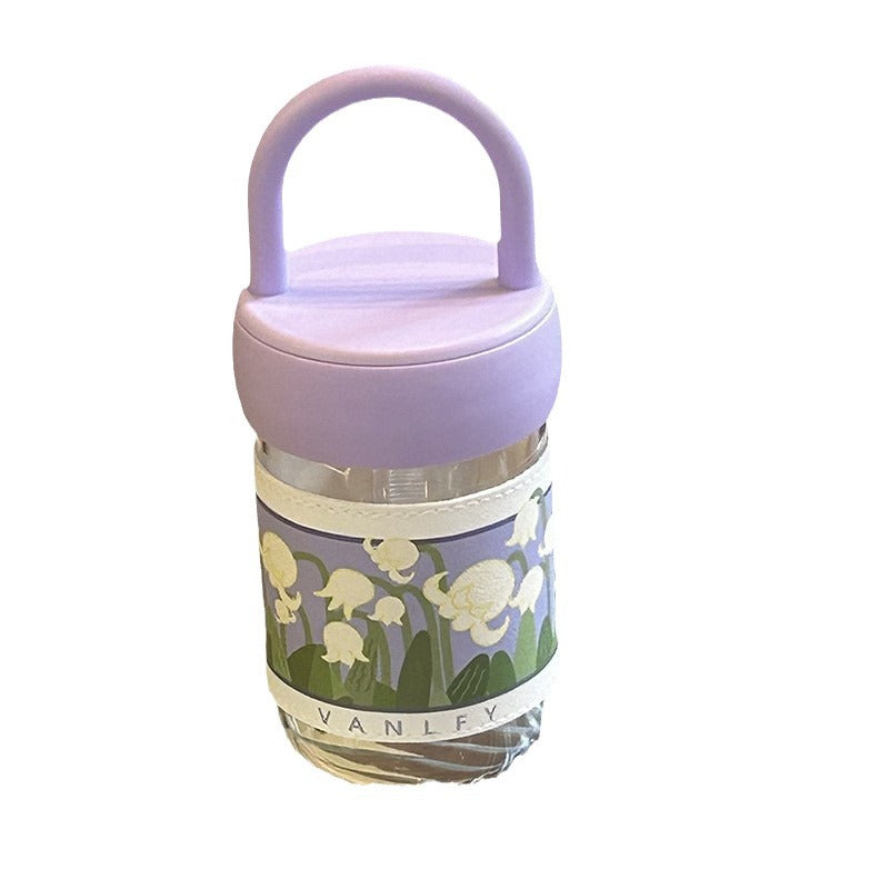 Women's insulated drinking bottle with ergonomic carrying handle and elegant flower design Stornfield