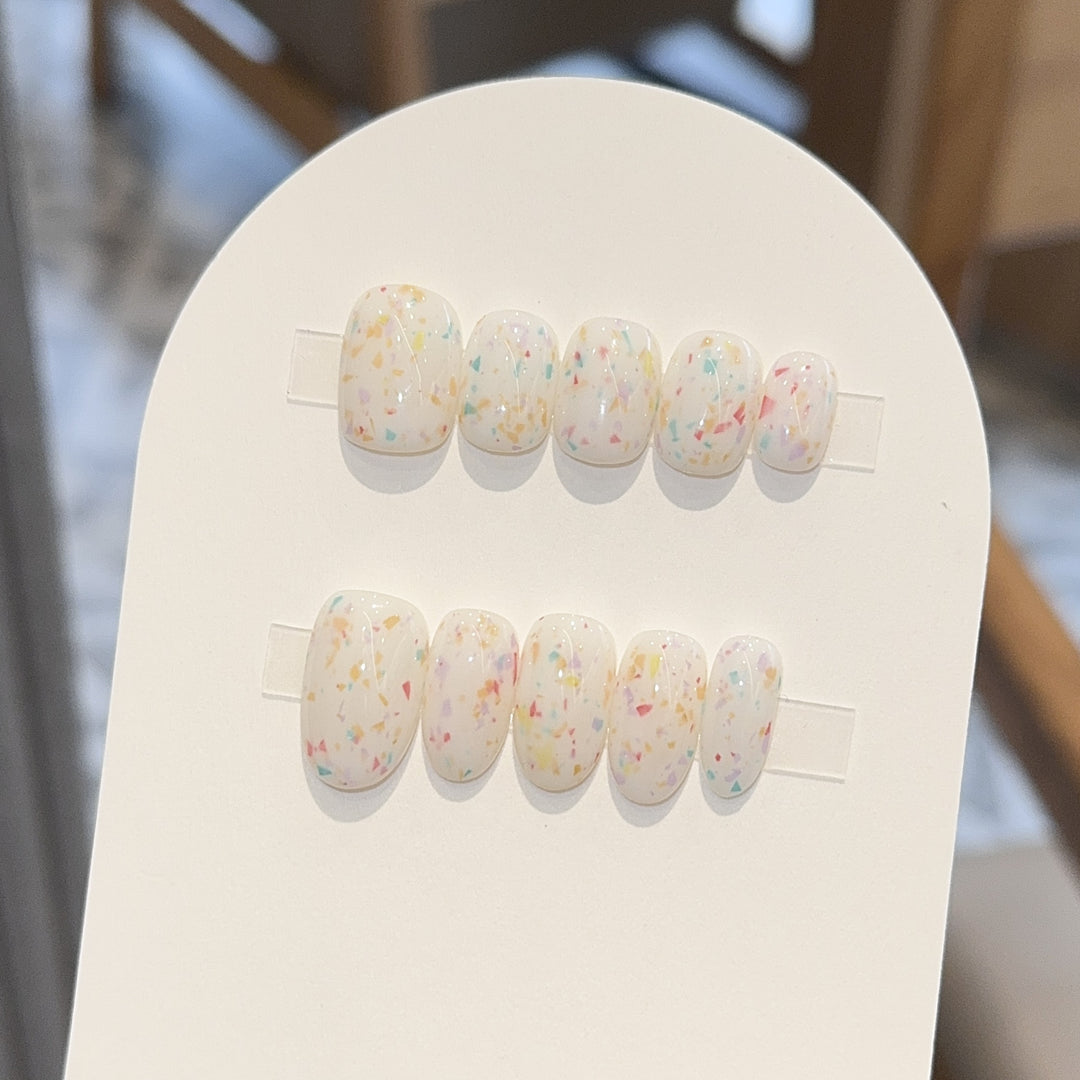 Artificial nails with cheerful sparkle design Stornfield