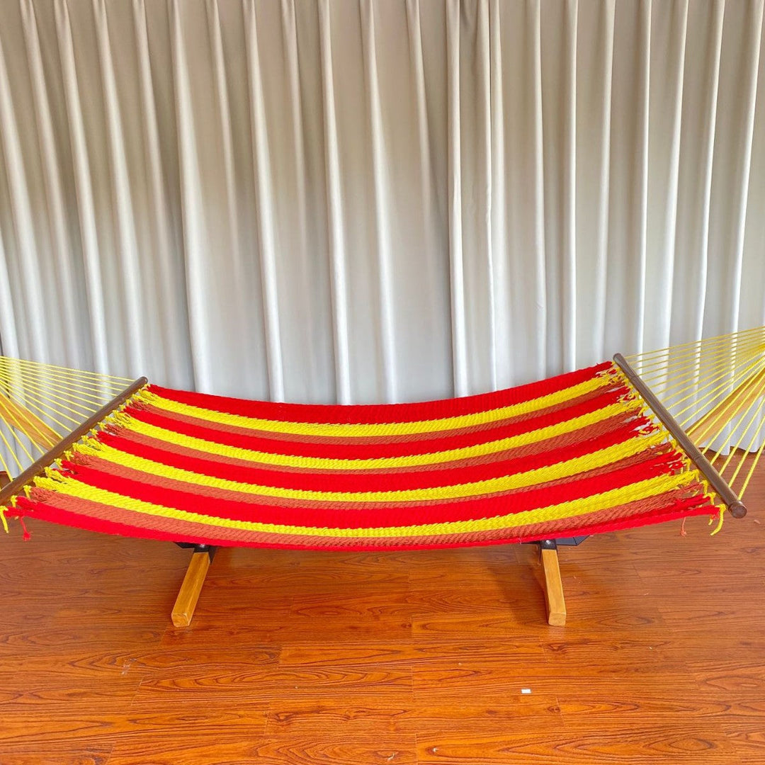 Woven cotton hammock with wooden spreader bars and freestanding stand Stornfield
