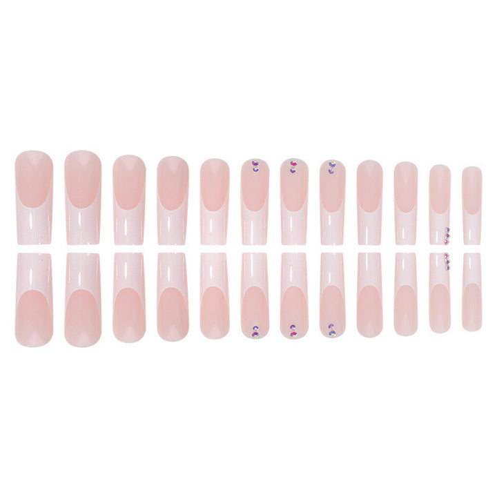 Nail set with elegant French tips and sparkling rhinestone embellishments Stornfield