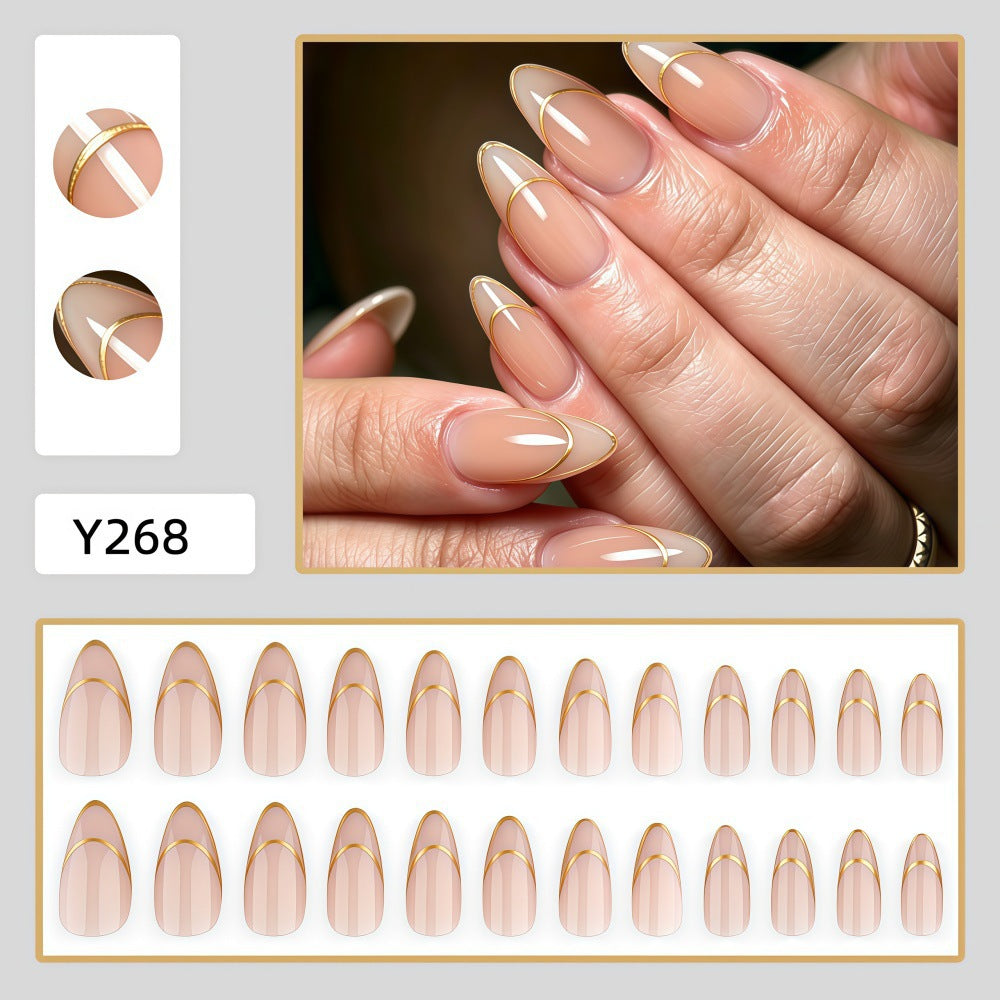 Artificial nails with elegant gold lines Stornfield