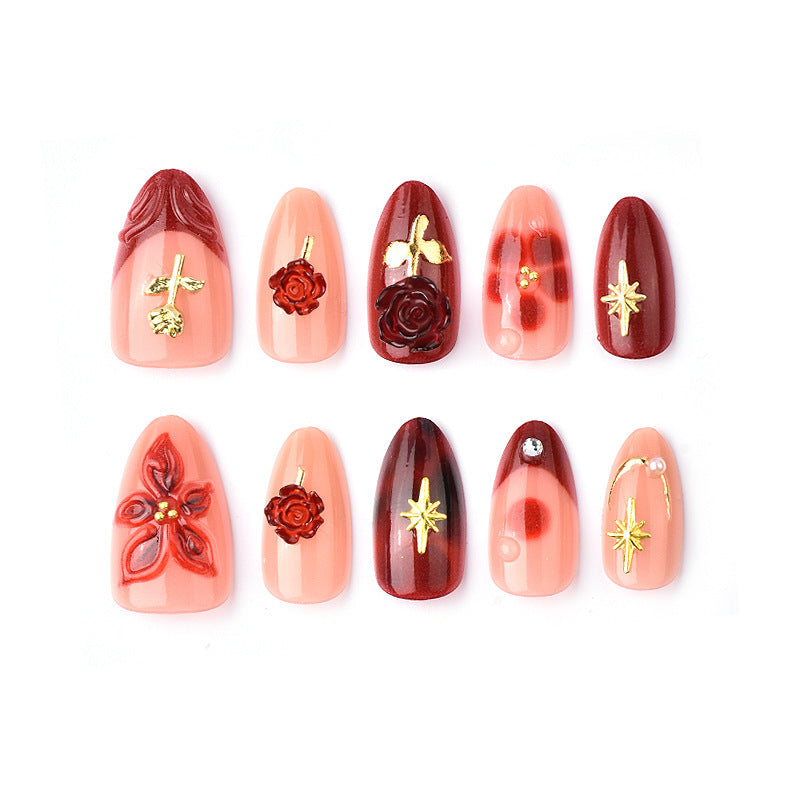 Artificial nail set with elegant floral applications and glamorous accents Stornfield