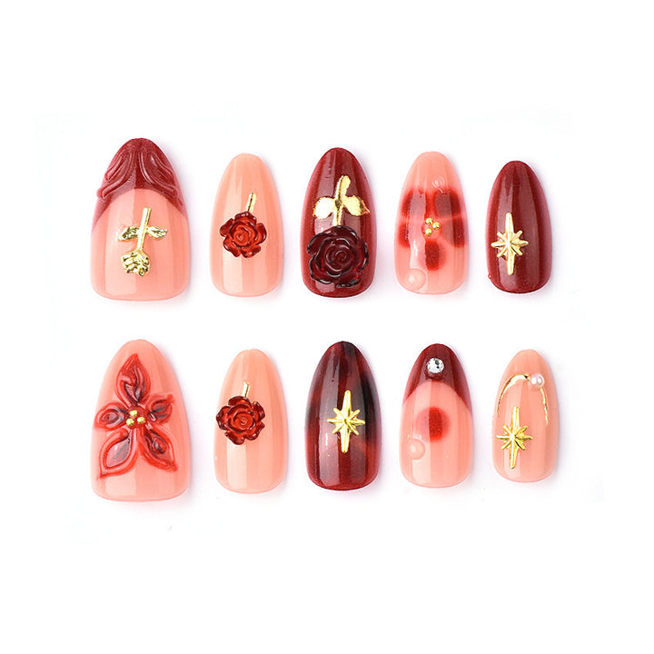 Artificial nail set with elegant floral applications and glamorous accents Stornfield