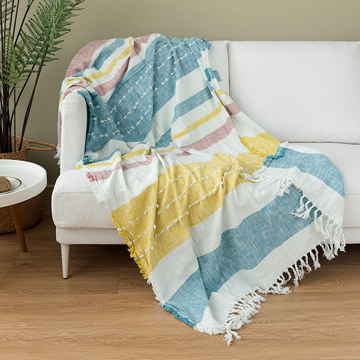 Light striped cotton blend throw blanket with decorative fringes