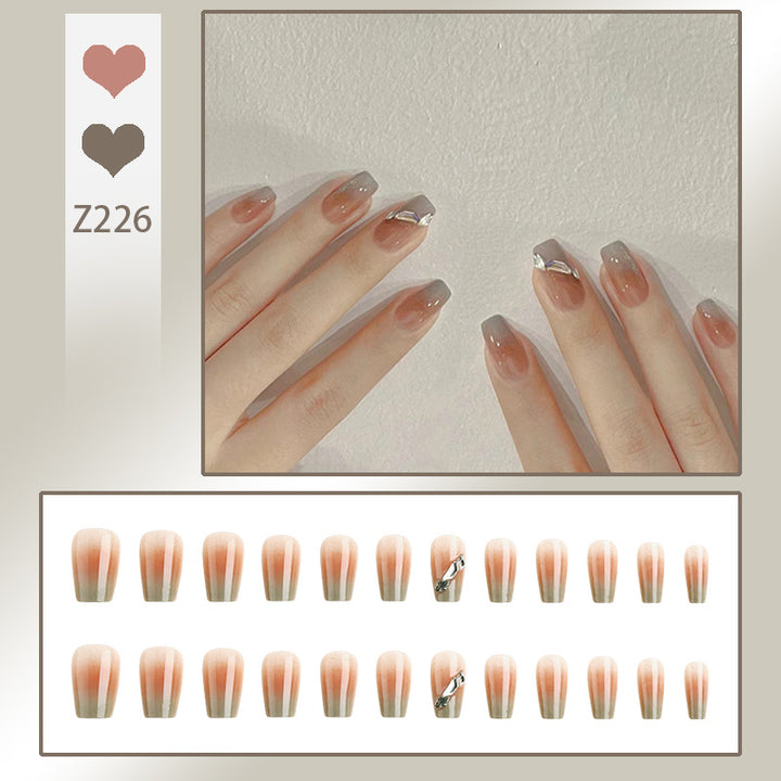 Artificial nail set with elegant ombre design and sparkling applications Stornfield