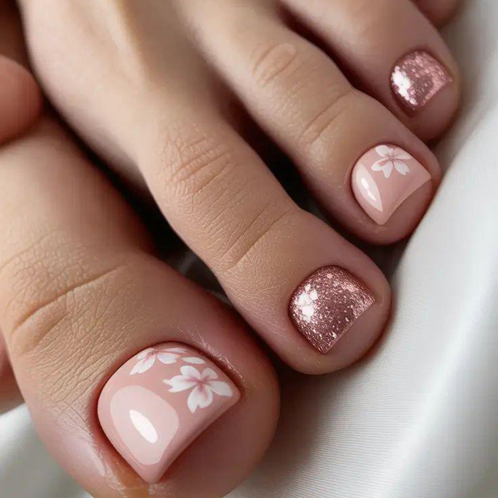 Fingernail art set with elegant floral design and glitter accents Stornfield