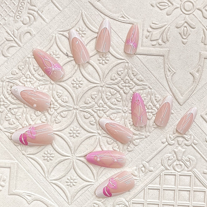 Artistic Press-On Nail Set with Kiss and Bow Design Stornfield