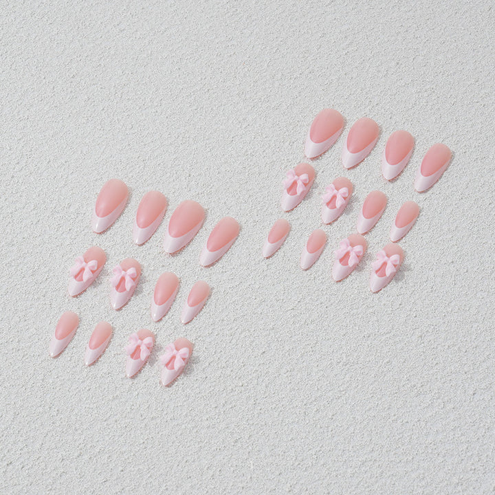 Nail art set with playful bow accents Stornfield