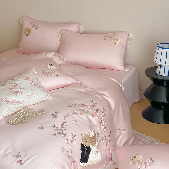 Satin bedding set with embroidered wedding bears, ruffled hem & decorative pillows