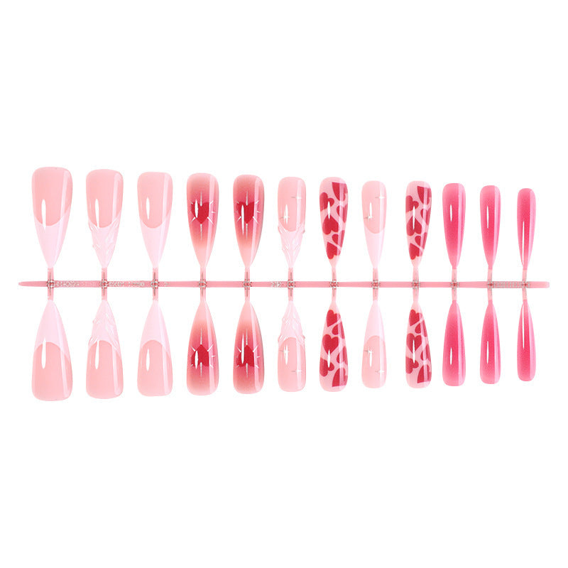 Artificial nail set with luxurious ombre design and creative heart motifs Stornfield