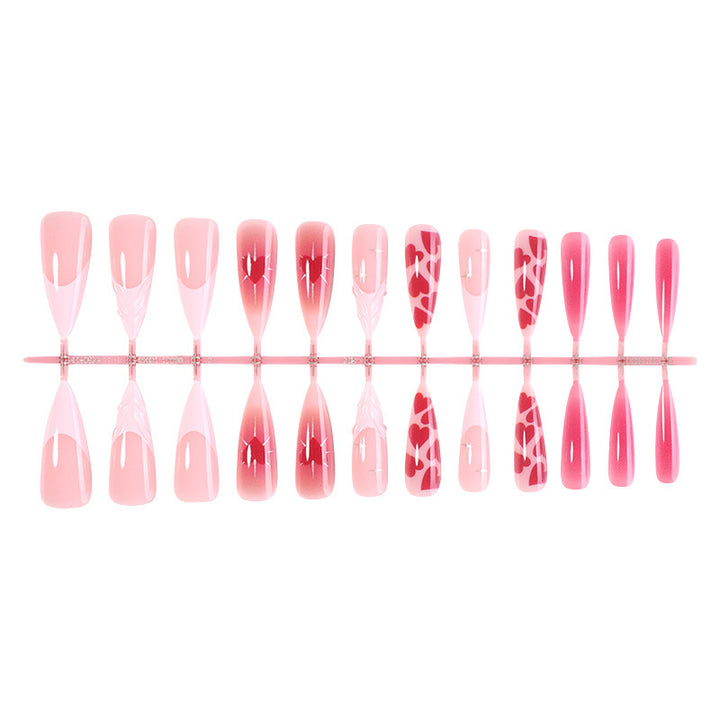 Artificial nail set with luxurious ombre design and creative heart motifs Stornfield