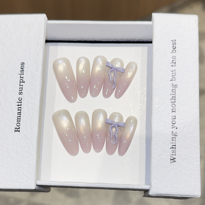 Artificial nails with romantic design and shimmering accents Stornfield