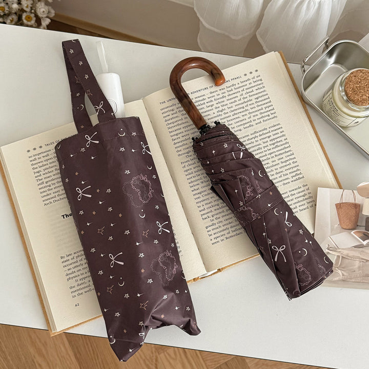 Women's folding umbrella with elegant pendant design Stornfield