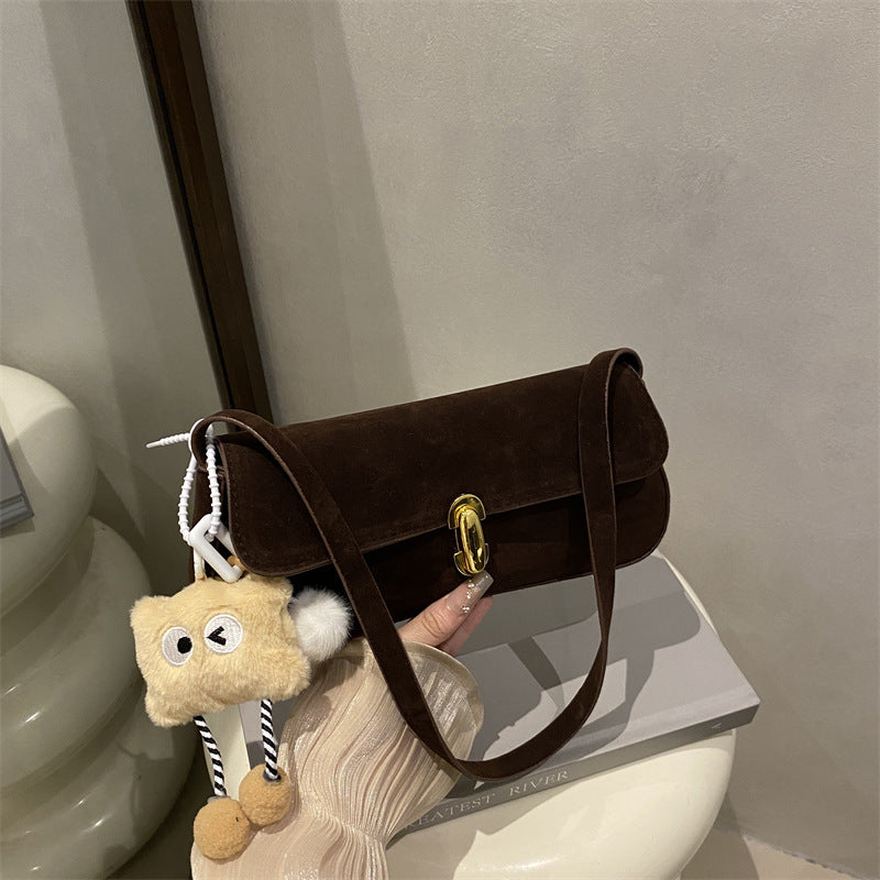 Elegant Suede Handbag with Playful Keychain