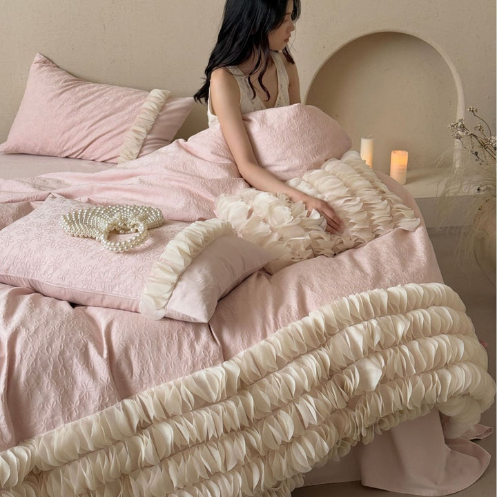 Romantic ruffle bedding set with layered frill and quilted bedspread